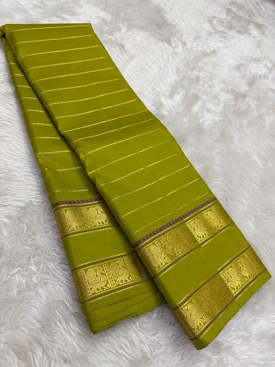 Full view of lime green handwoven Kanchipuram pure silk saree with seepu reku body and rettapet border — Idam Living