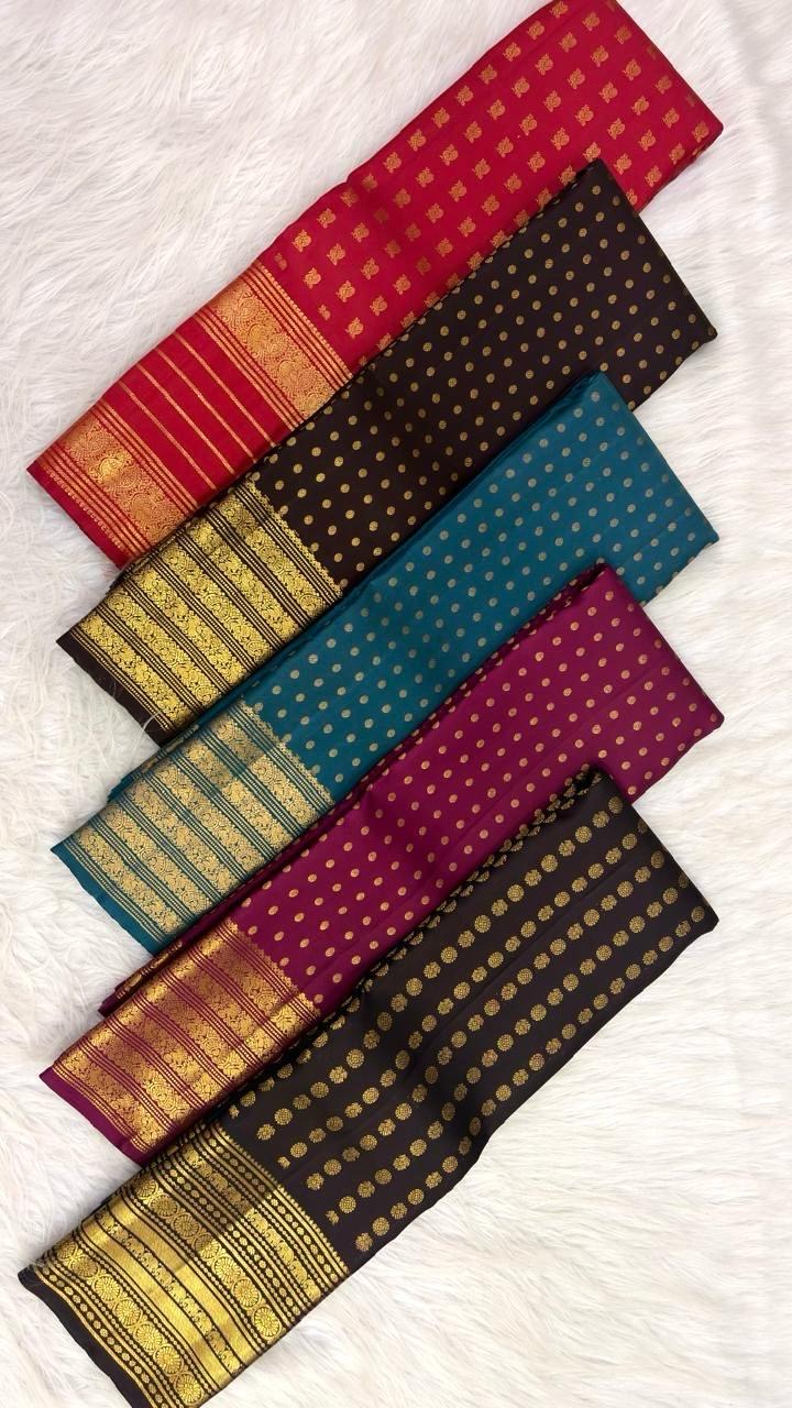 Close-up of round gold buttas on the deep brown silk body.