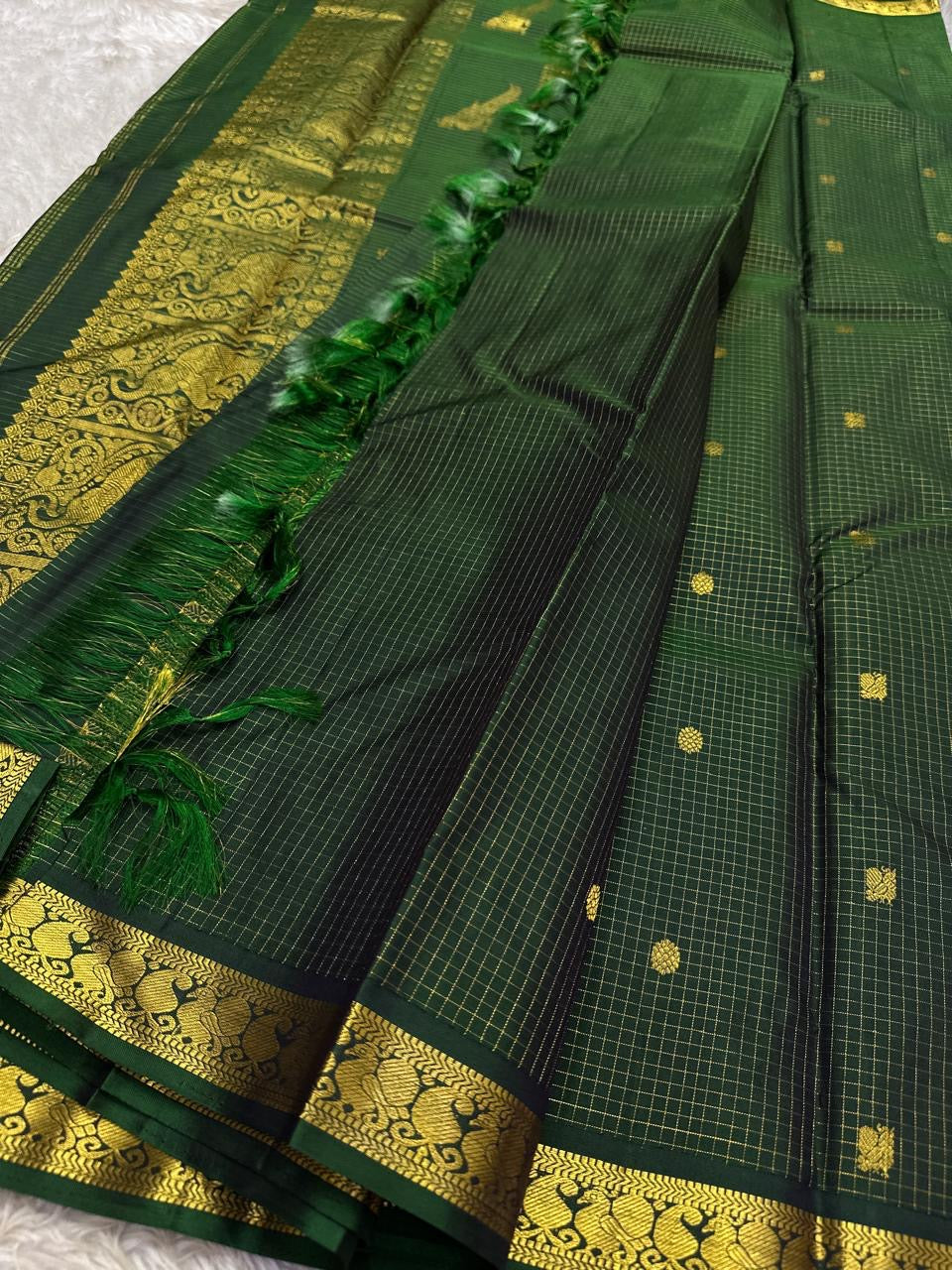Handwoven pure silk Kanjipuram saree in dark bottle green with Zari Kattam body Pavun coin butta and Mayil antique gold zari border Silk Mark certified