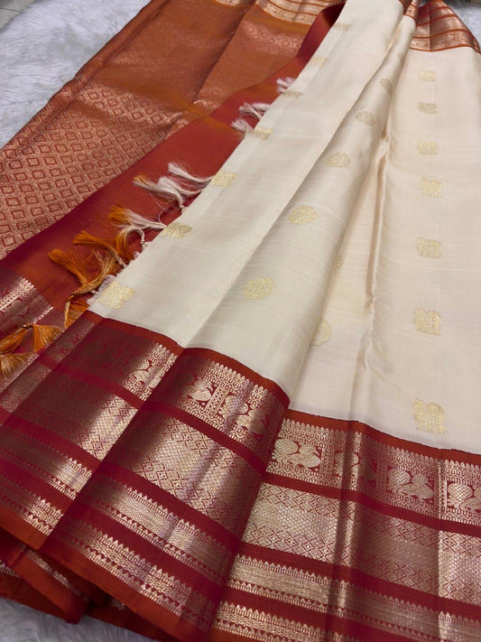 Milk White and Arakku Red Handwoven Pure Silk Kancheepuram Saree with Mayil Chakram Zari Butta and Varisaipet Border