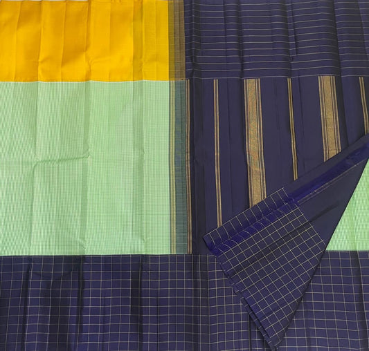 Full view of mubbagam Kanjipuram silk saree in mint green mustard and navy on banana leaf — Idam Living