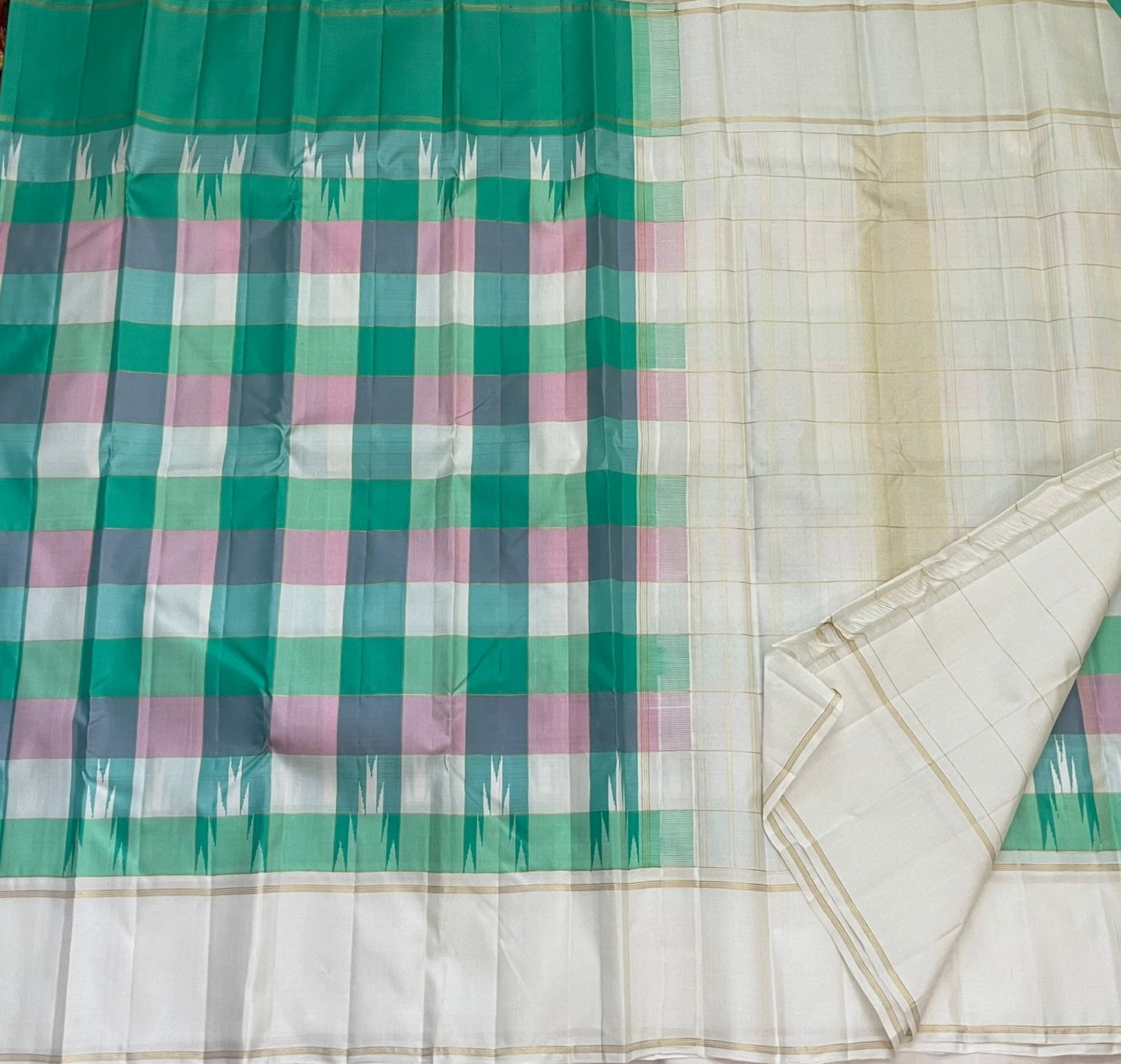 Paalum Pazhamum Kanjivaram silk saree folded showing vibrant multicolour Kanchi Kattam check body and Ganga Jamuna border