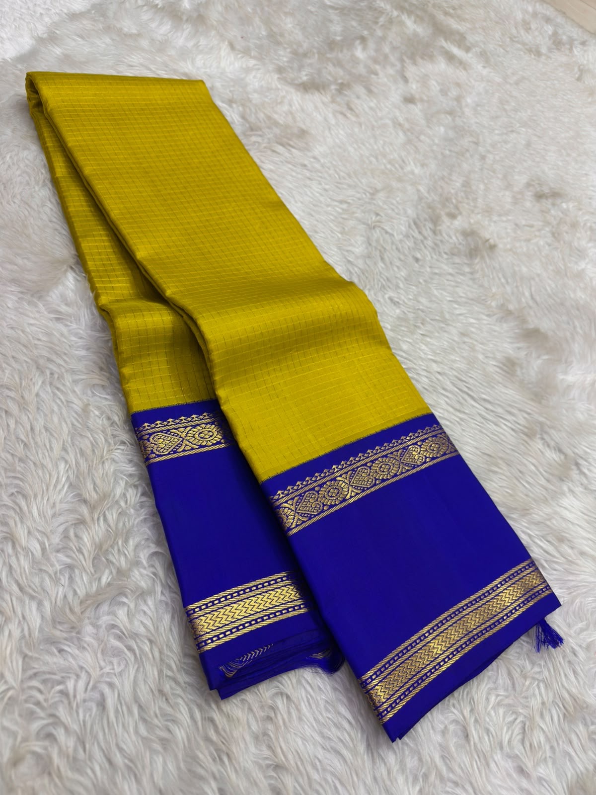 Close-up of zari kattam grid weave on turmeric mustard Kanchipuram pure silk saree — Idam Living