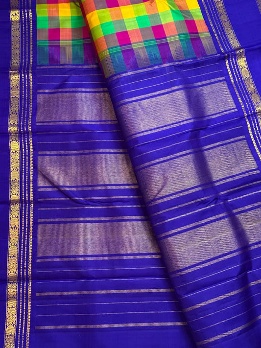 Jewel-toned Madras checks pallu of neelam blue Kanchipuram silk saree