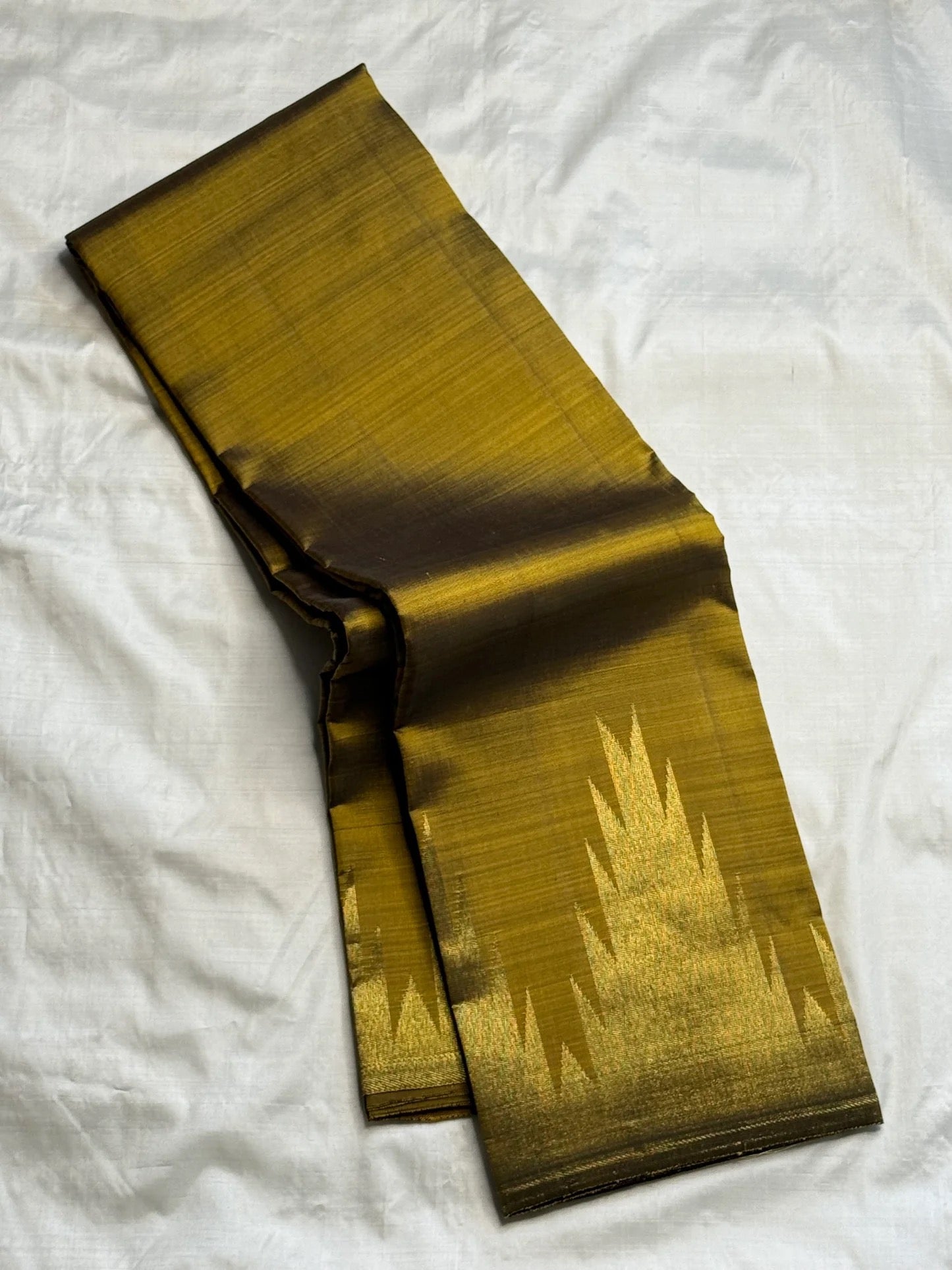 Full view of olive green handwoven Kanchipuram silk saree with ettukol antique copper border — Idam Living