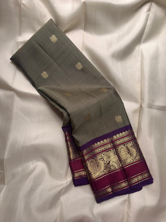 Handwoven Olive Green Kanchipuram silk saree with antique gold zari buttas