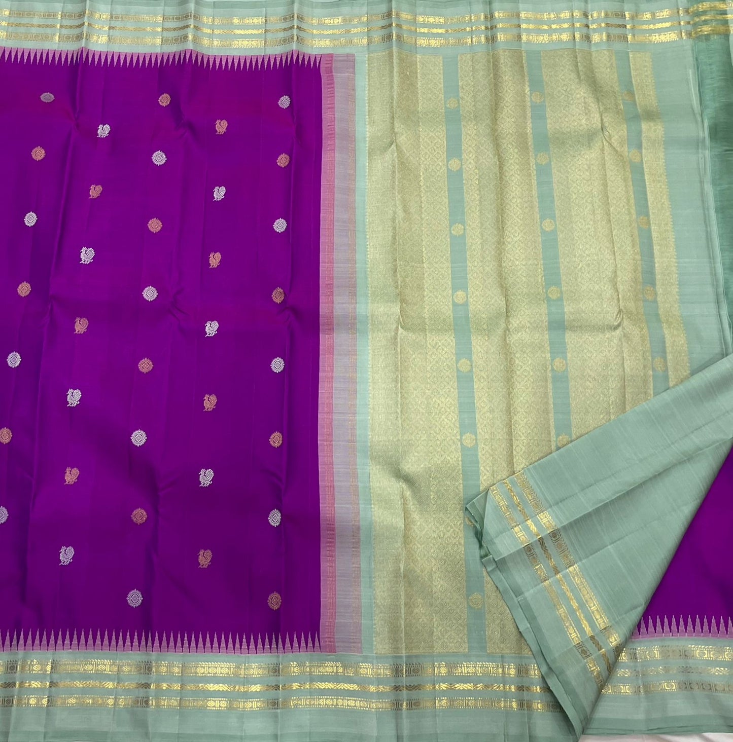 Handwoven pure silk Kanjipuram saree in orchid purple with Mayil Chakram buttas and ice blue Korvai border Silk Mark certified