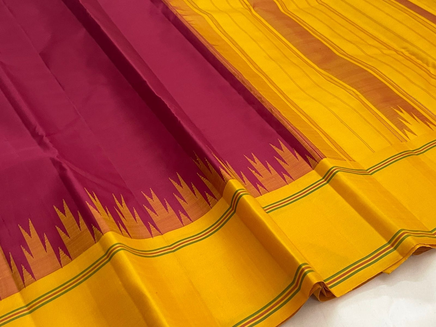Handwoven pure silk Kancheepuram saree in deep arakku red with Pattupet silk-only weave and canary yellow Thazhampoo Reku Korvai border Silk Mark certified