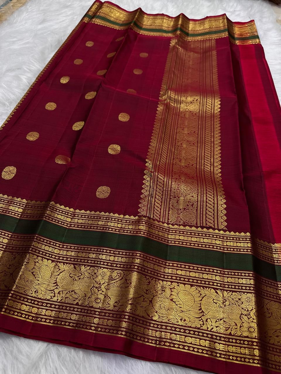 Peacock Blue and Maroon Handwoven Pure Silk Kancheepuram Saree with Maanga Butta and Gandaberunda Border
