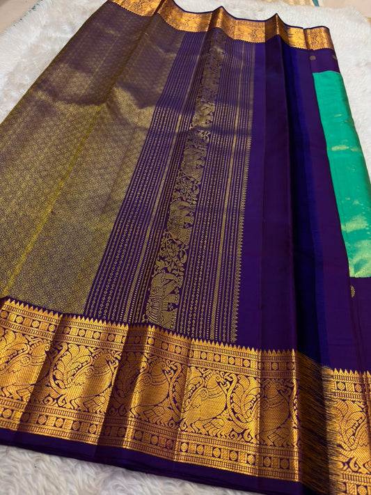 Korvai border detail on peacock teal and deep purple handwoven Kanchipuram pure silk saree — Idam Living