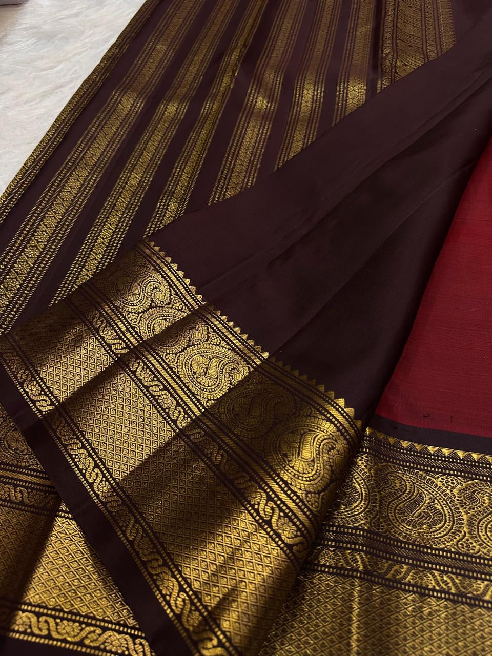 Vermilion Orange-Red Kanjipuram Saree — deep aubergine border with gold zari elephant motifs