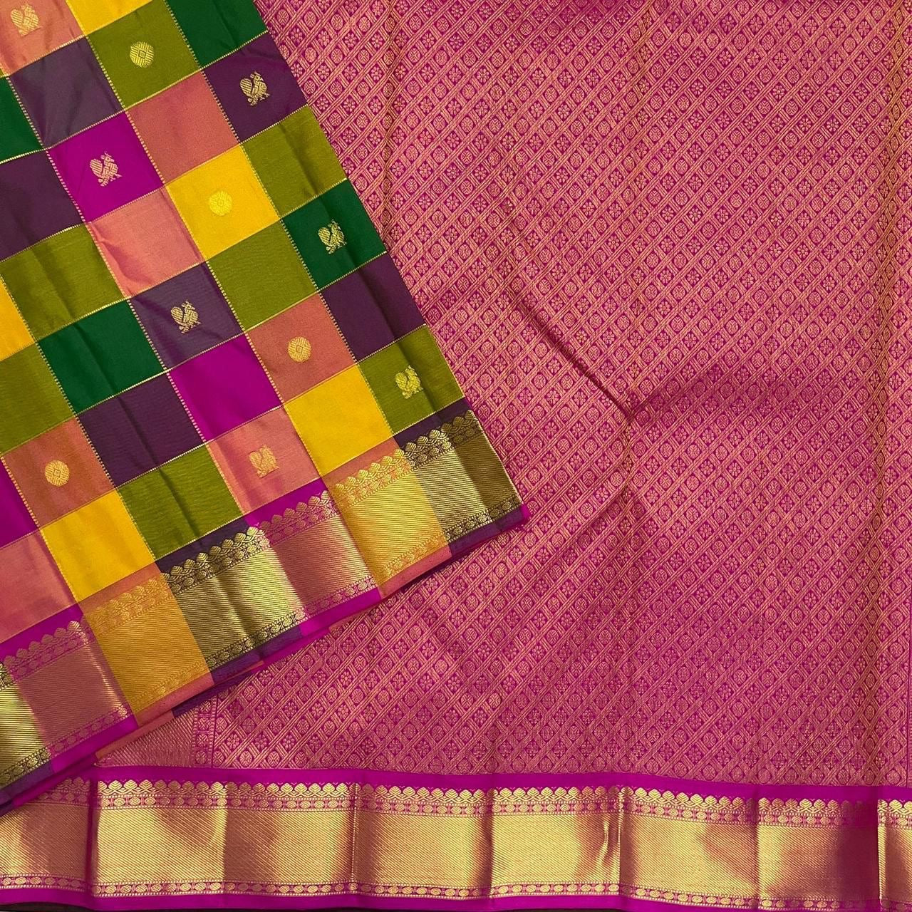 Magenta pallu close-up with all-over zari weave next to checked Pure Kanchipuram silk saree, available in the USA.