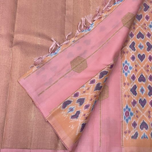 Radiant pink pure silk Kanchipuram saree with Pochampally ikat fusion and zari detail — body close-up