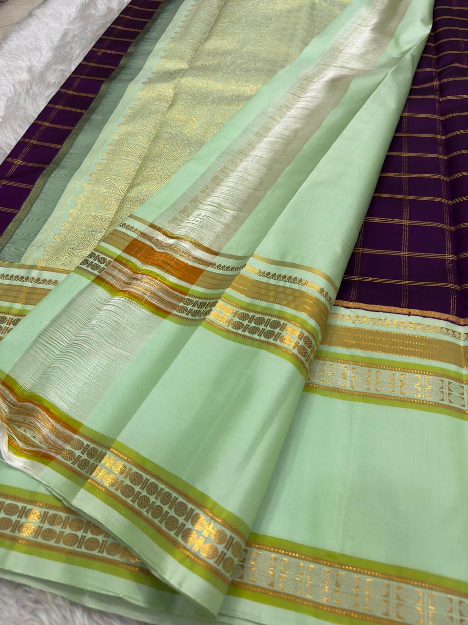 Pista Green Pure Silk Kanjivaram Rettapet saree with Deep Purple broad border