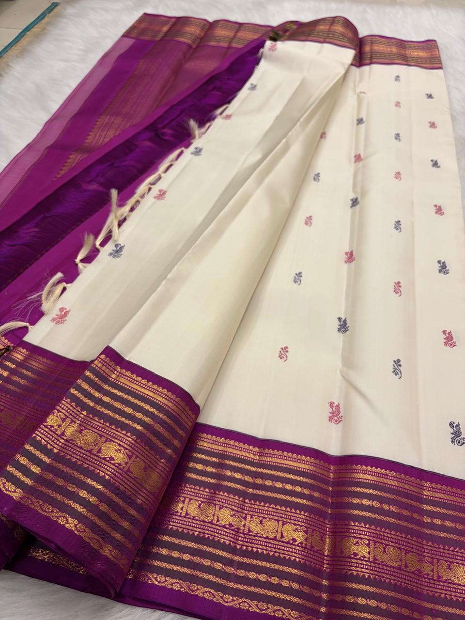Ivory Kanjivaram Korvai silk saree, peacock buttas with Varisaipet zari border and grand pallu