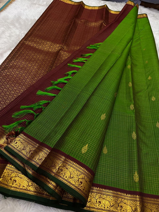 Green Kanjivaram silk saree with traditional antique gold grid detailing