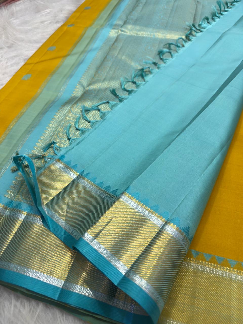 Golden yellow and blue zari border close-up, Kancheepuram silk saree