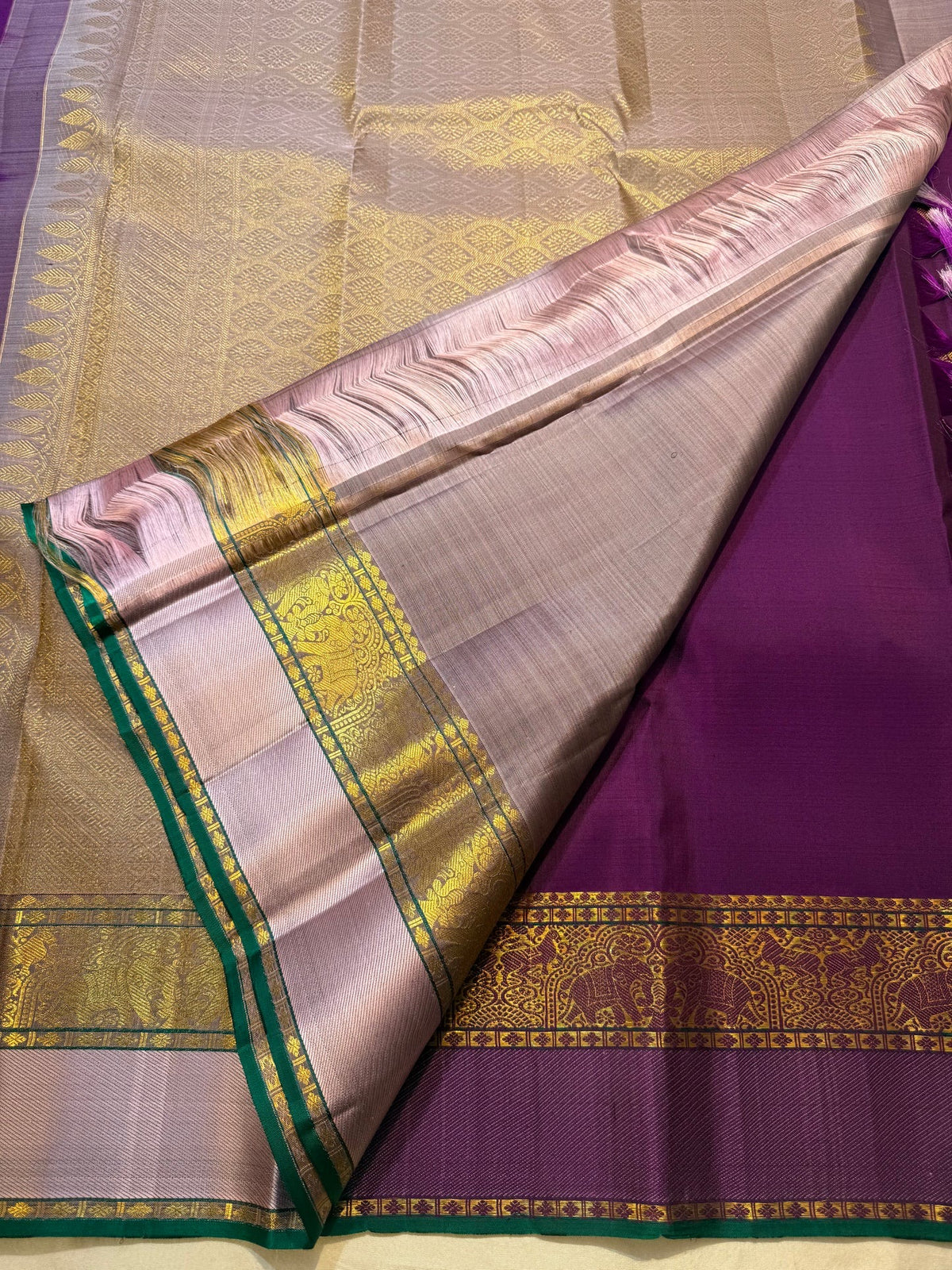 Emerald Green selvedge along the Purple saree edge.