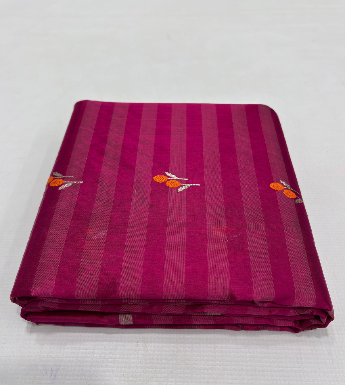 Raspberry Pink striped Pattu Silk Chanderi saree with small orange-and-ivory woven motifs and ornate metallic pallu.