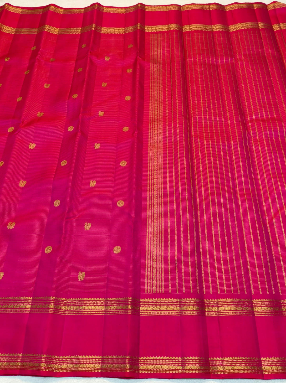 Handwoven pink Kanjivaram saree with fine oosi gold zari line stripes