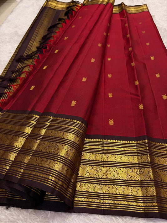 Red handloom korvai Kanjivaram silk saree with traditional gold zari