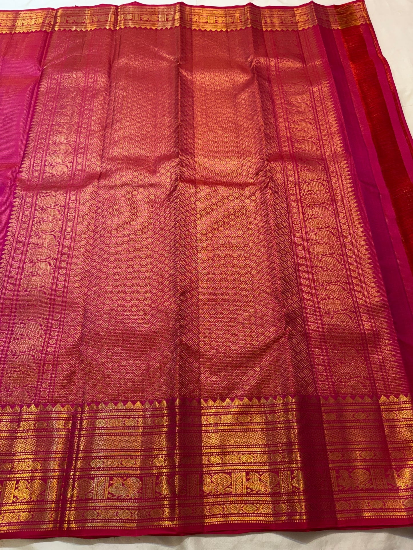 Red-Pink Double Shot pure silk Kanchipuram Vairaoosi saree with rich gold zari border.