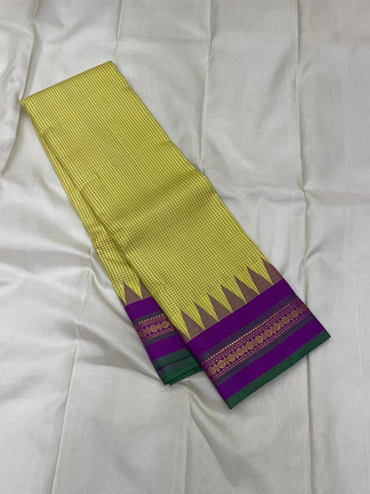 angled fold view of chartreuse grid checked kanchipuram silk saree showing purple zari woven border
