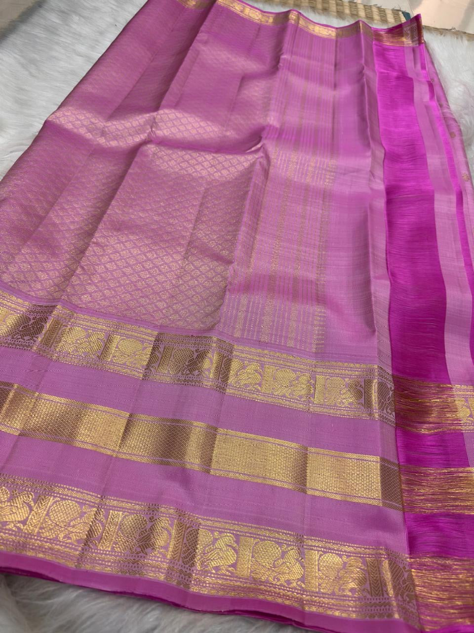 Rose Orchid Pink KanchiPattu Varisaipet saree showing elaborate gold zari pallu and border.