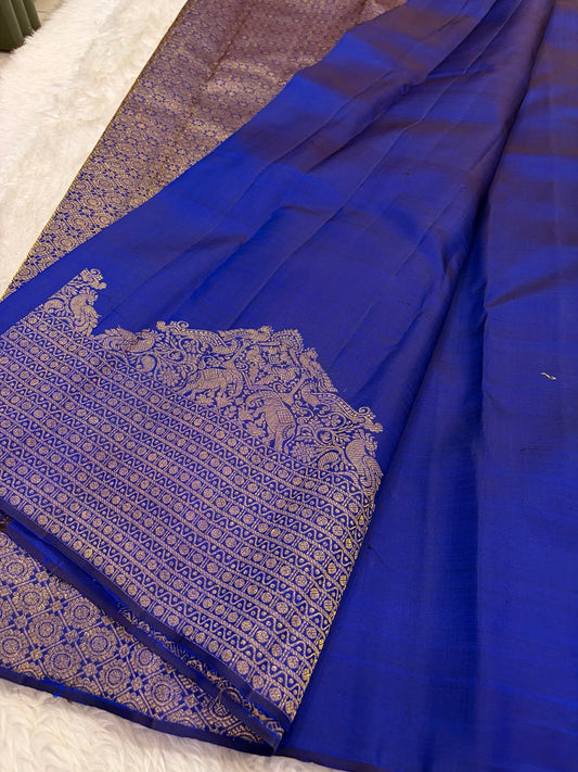 Royal Blue Kanchi Pattu silk saree body close-up showing gold zari floral butta motifs
