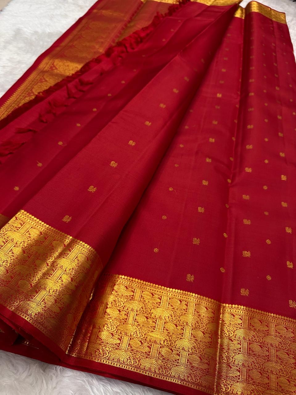 Kanchipattu silk saree in ruby red with antique gold border Varisaipet weave traditional zari detail