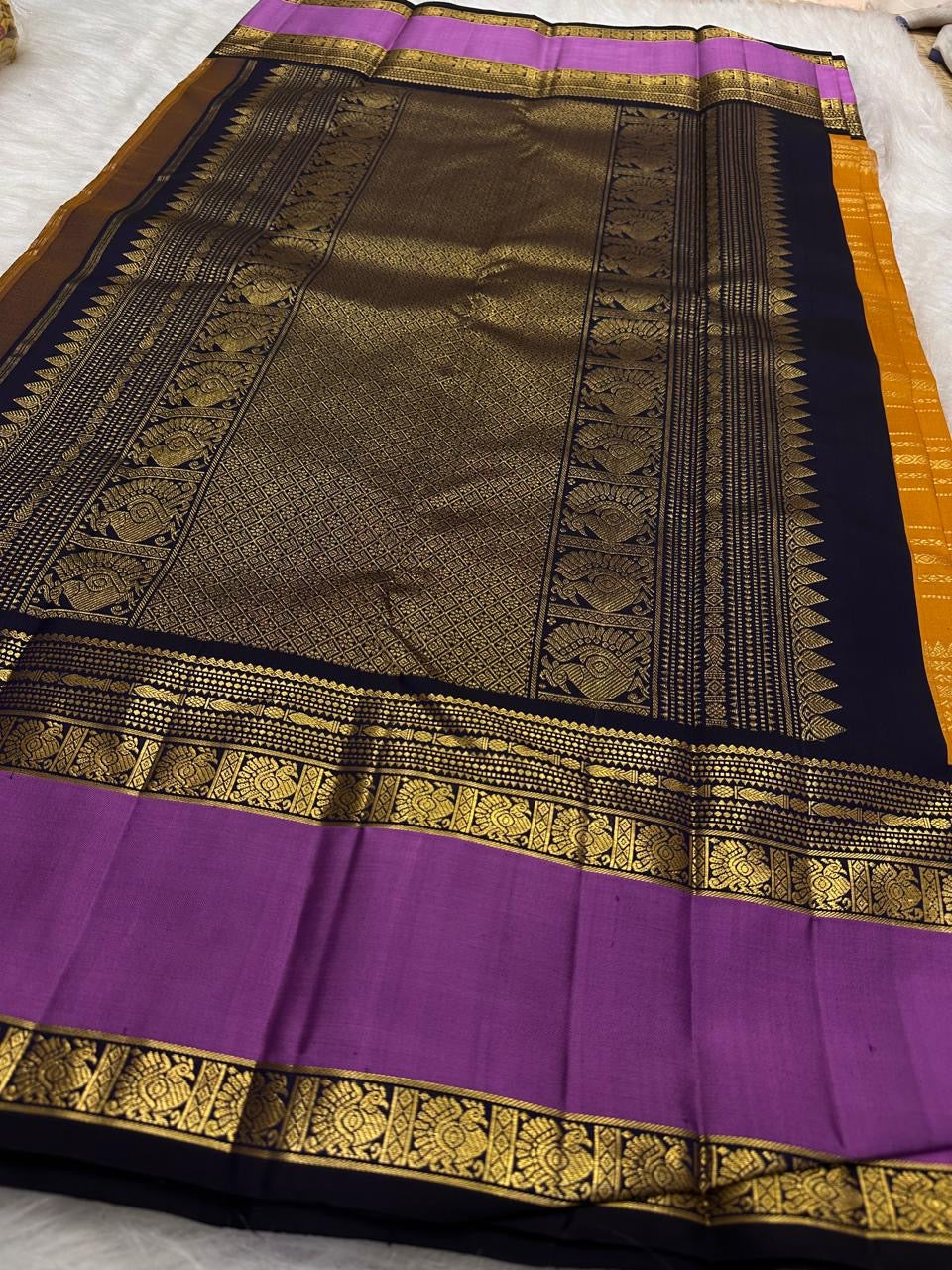 Saffron Marigold Handwoven Pure Silk Kanjipuram Korvai Saree with Orchid Purple Border and Veldhari Zari