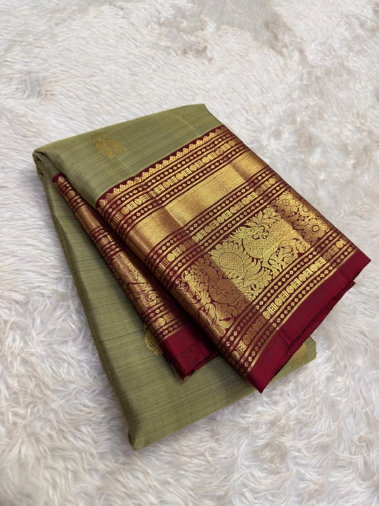 Close view of sage green Kanjipuram silk body with ornate gold zari Yaanai Ambari elephant procession Butta