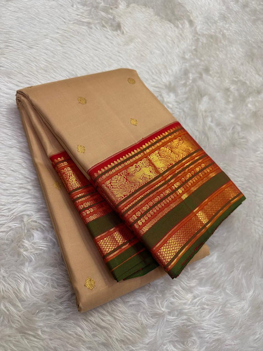 Close-up of kamalam lotus butta in gold zari on sandstone beige Kancheepuram silk saree — Idam Living