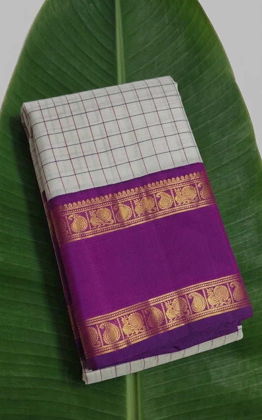 Handwoven Kanjivaram silk saree with silver kattam checks and vibrant orchid pink border