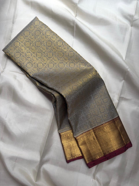 Silver Grey pure silk Kanjeevaram Korvai saree with broad gold zari border.