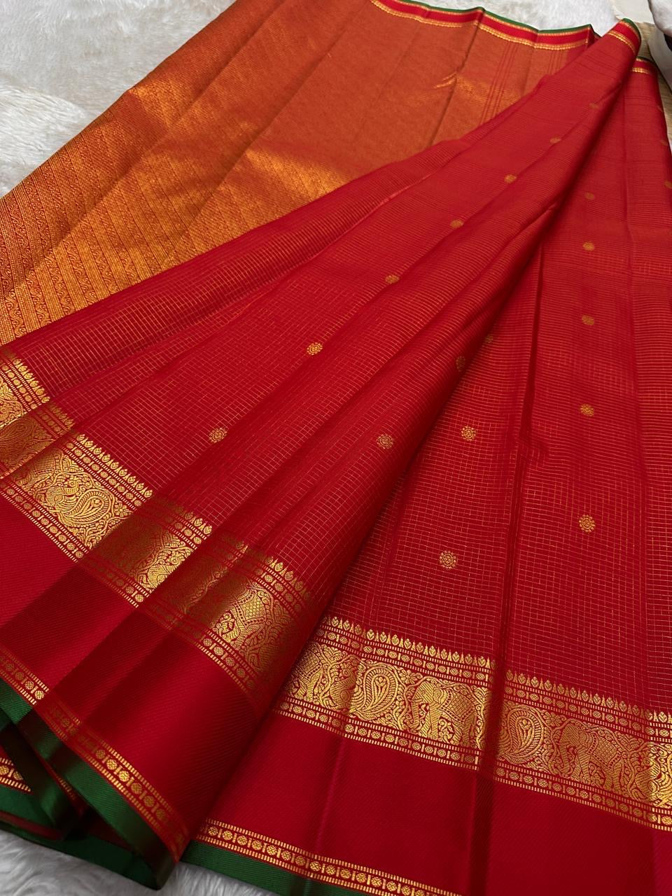 Sindoor red Pure Silk Kanjipuram Zari Kattam saree with fine gold lattice and narrow green selvedge