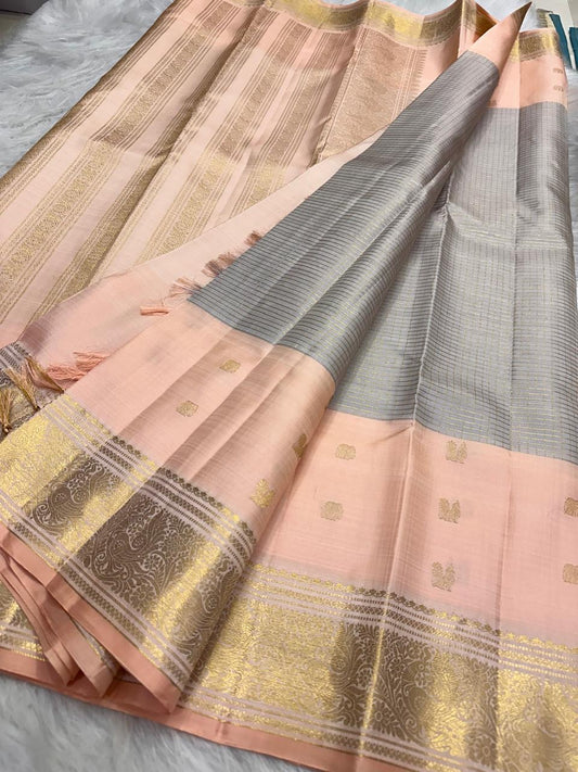 Soft Peach Pink and Silver Grey pure silk Kanjivaram Butta saree with antique-gold border.