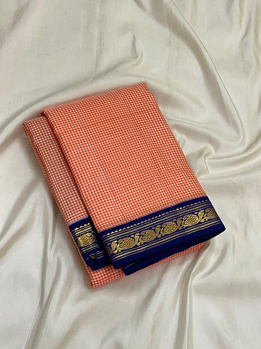 Traditional Kanchi Kattam Kanjeevaram saree with royal blue border, close-up