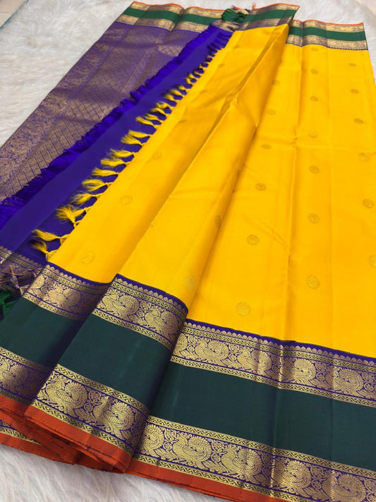 Turmeric Yellow Pure Silk Kanchipuram Rettapet saree with emerald green border