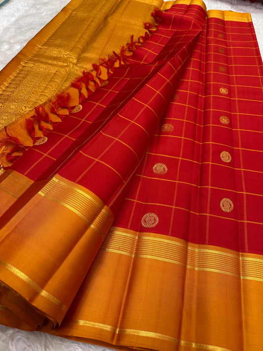 Vermilion red Kanjivaram silk saree with gold zari buttas, body close-up