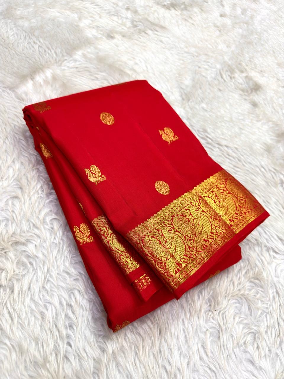 Vermillion red Kanjivaram silk saree with mayil chakram butta – drape view