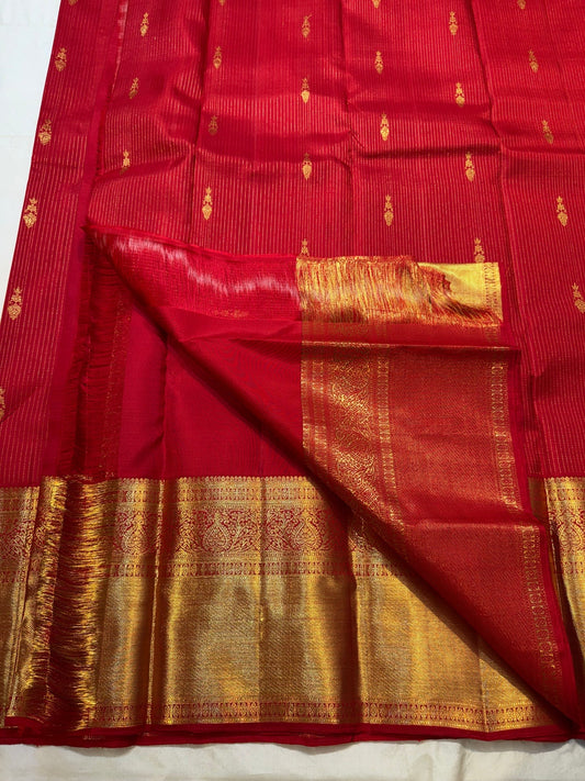 Chedi butta in gold zari close-up on vibrant red Kanchipuram pure silk saree — Idam Living