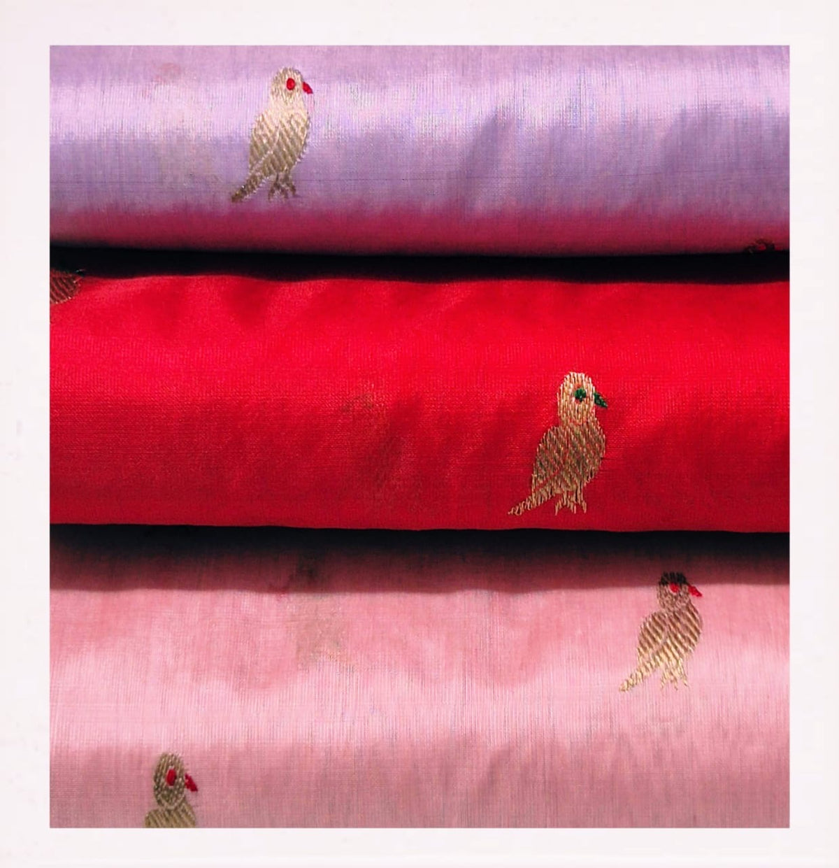 Close-up of golden parrot buttas on wisteria lavender Chanderi saree body