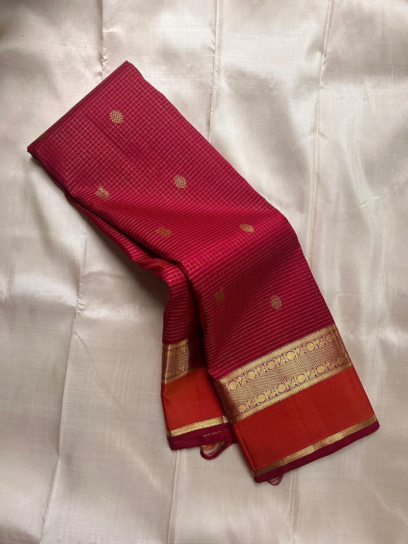 Pure silk Kanchipuram saree in red with gold zari border and traditional motif design