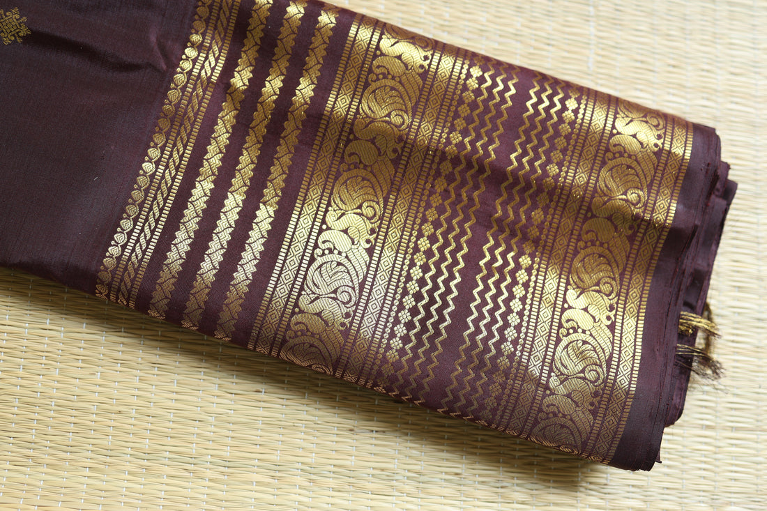 Kanjeevaram silk saree with rich gold zari border on traditional woven fabric