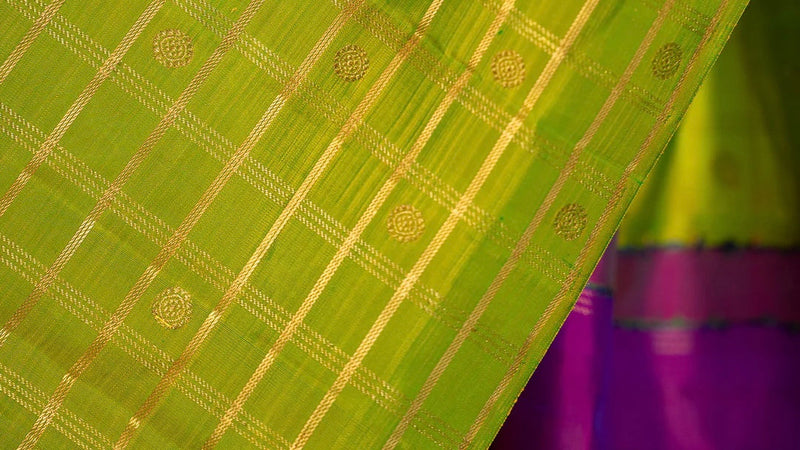 Handwoven pure silk Kanchipuram saree featuring Zari Kattam luminous gold zari grid body woven by master weavers in Tamil Nadu