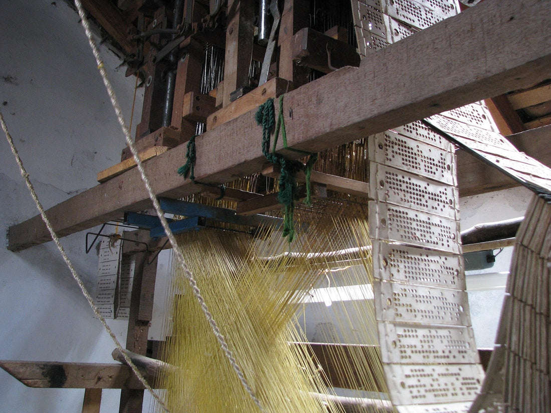 Master weaver at traditional Kanjivaram handloom in Kanchipuram, Tamil Nadu — Idam Living craft series showing the 18-step pure silk saree making process