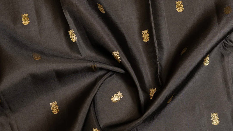 Kanchipuram pure silk sarees with handwoven gold zari butta motifs including peacock, lotus and coin designs
