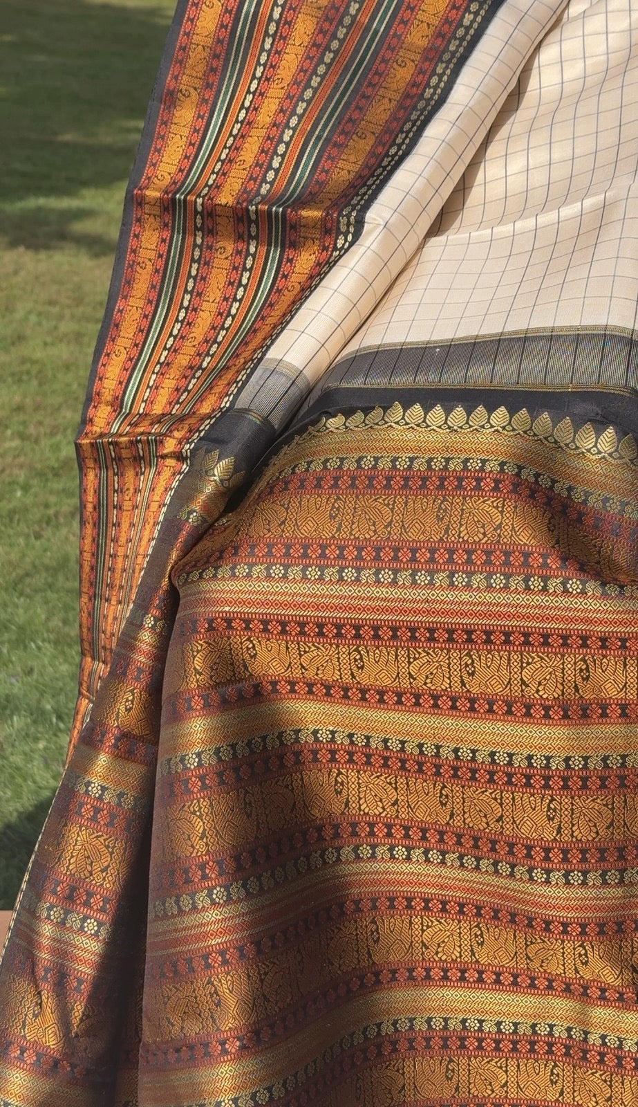 Close-up of antique gold zari on Kanjivaram silk saree