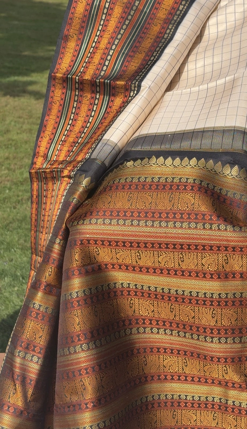 Close-up of antique gold zari on Kanjivaram silk saree